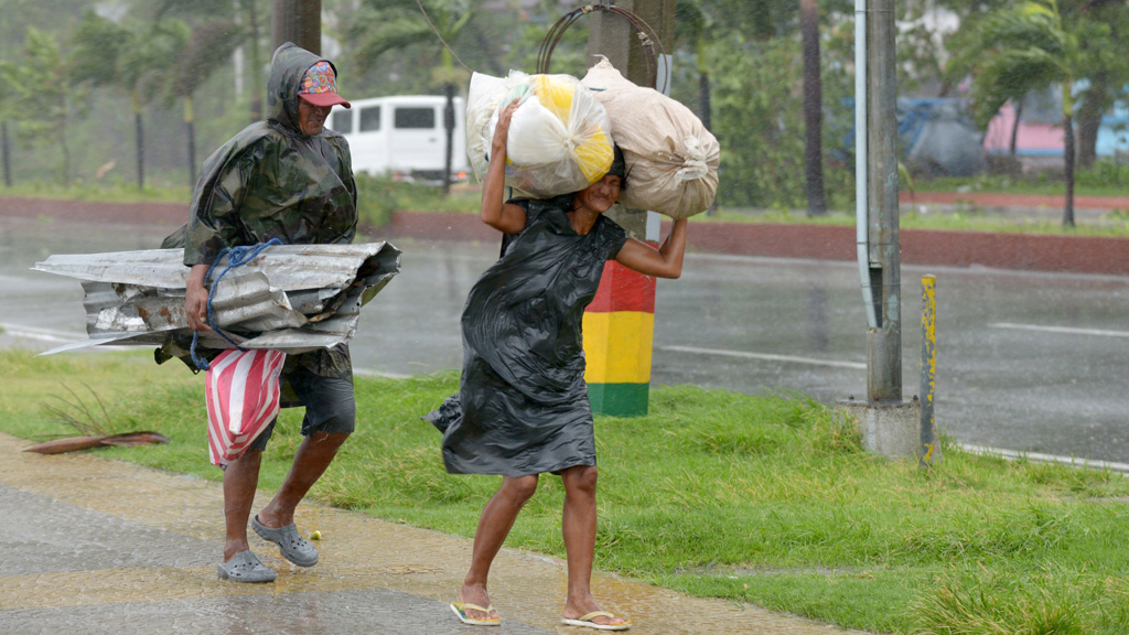 Thousands flee as typhoon hits Philippines – Channel 4 News