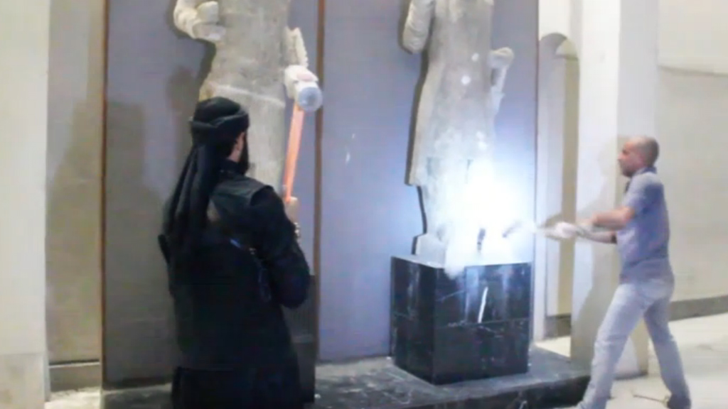 Islamic State fighters smash historic statues in Iraq Channel 4 News