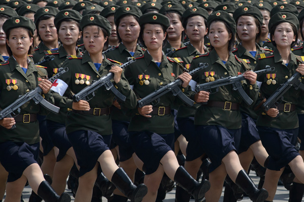 In a photo taken on July 27, 2013 female North Korean soldiers march through Kim Il-Sung square during a military parade marking the 60th anniversary of the Korean war armistice in Pyongyang. North Korea mounted its largest ever military parade on July 27 to mark the 60th anniversary of the armistice that ended fighting in the Korean War, displaying its long-range missiles at a ceremony presided over by leader Kim Jong-Un. AFP PHOTO / Ed Jones (Photo credit should read Ed Jones/AFP/Getty Images)