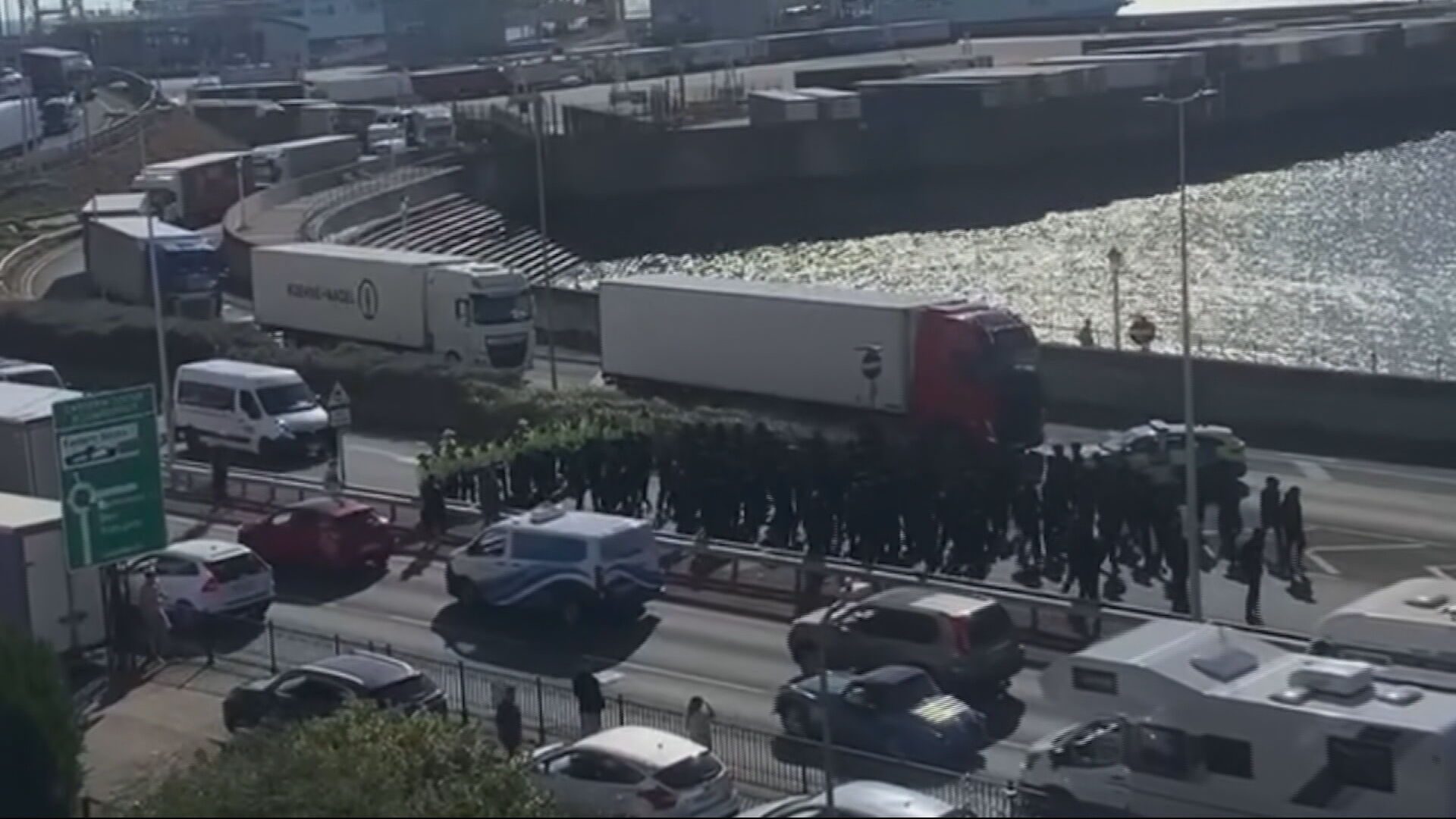 Government condemns anti-migrant masked protests